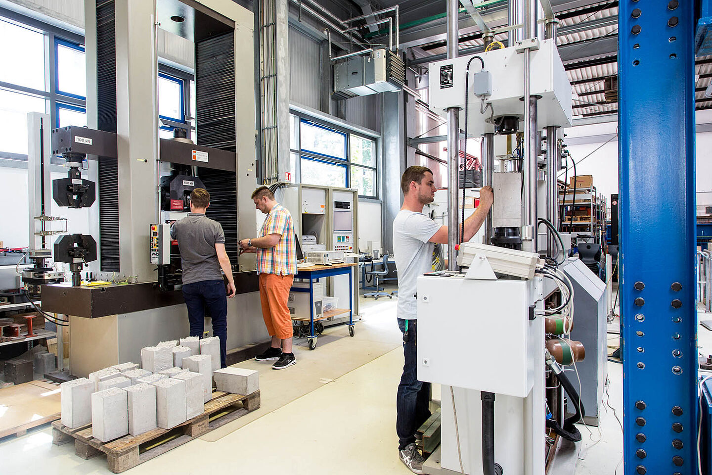 People working on the machines in the hall