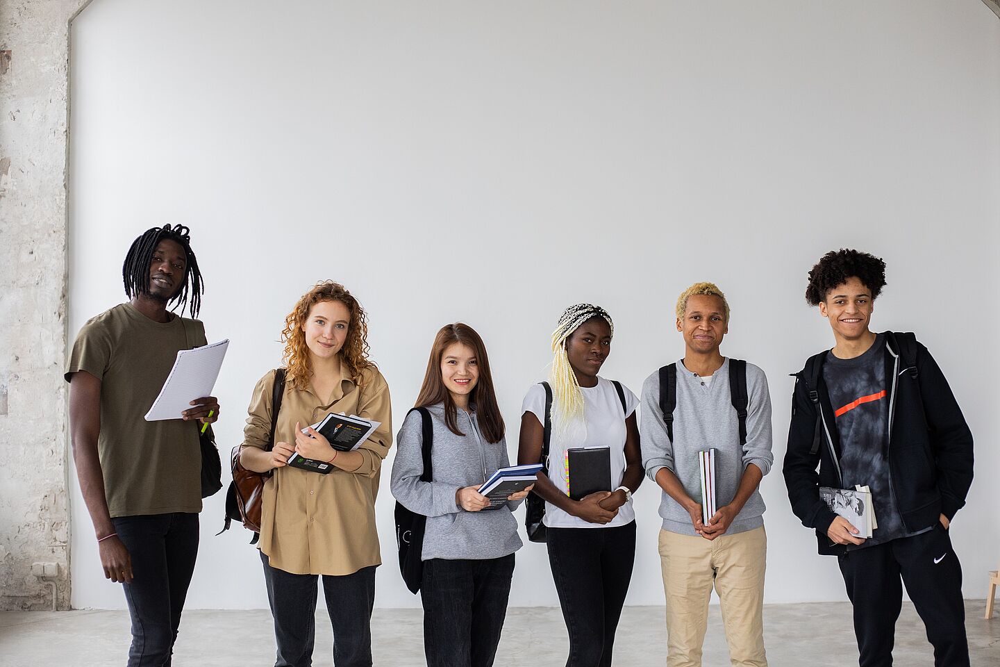 Six young people from different backgrounds side by side